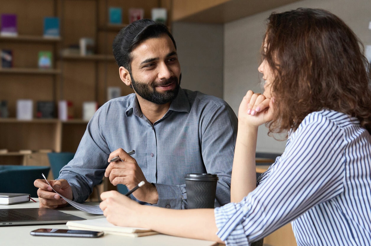 Two colleagues at work in discussion