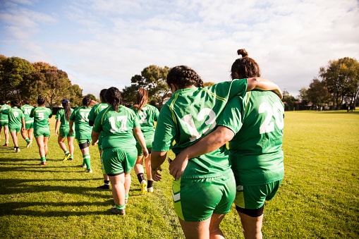 Women leaving field after game